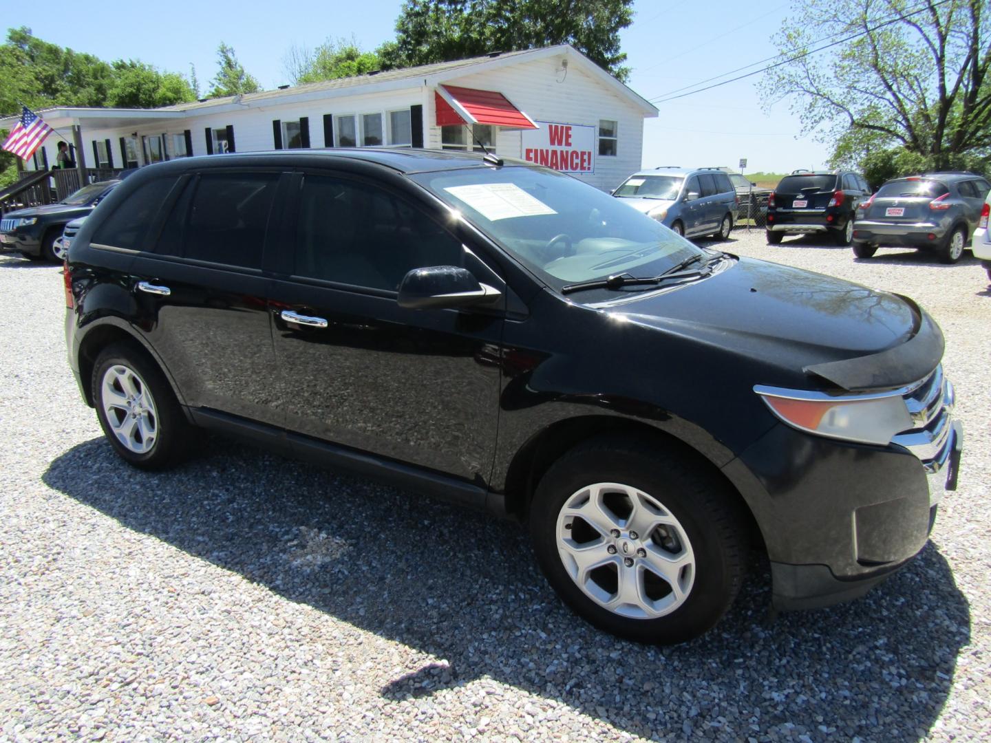 2011 Black /Tan Ford Edge SEL FWD (2FMDK3JC4BB) with an 3.5L V6 DOHC 24V engine, Automatic transmission, located at 15016 S Hwy 231, Midland City, AL, 36350, (334) 983-3001, 31.306210, -85.495277 - Photo#0